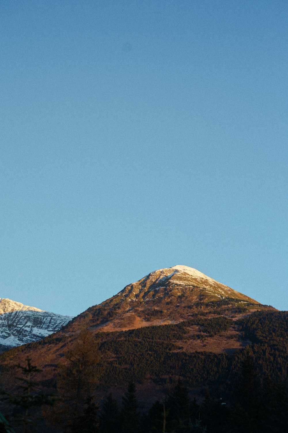 a view of a mountain with snow on it