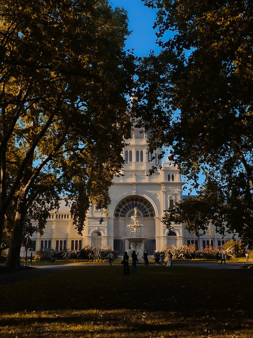 a large white building with a clock tower