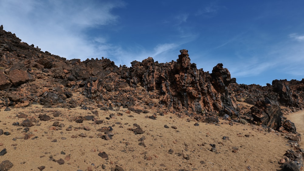 a rocky area with rocks and dirt on a sunny day