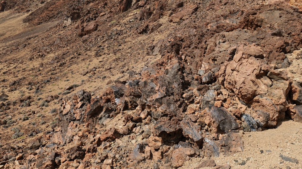 a mountain side with rocks and dirt on it