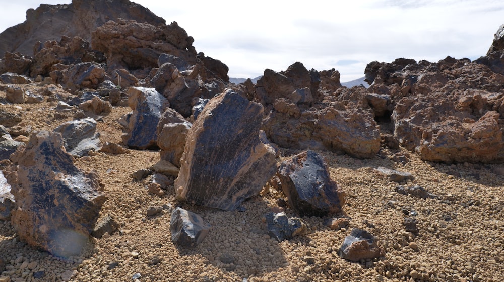 rocks and gravel on the ground with a sky background