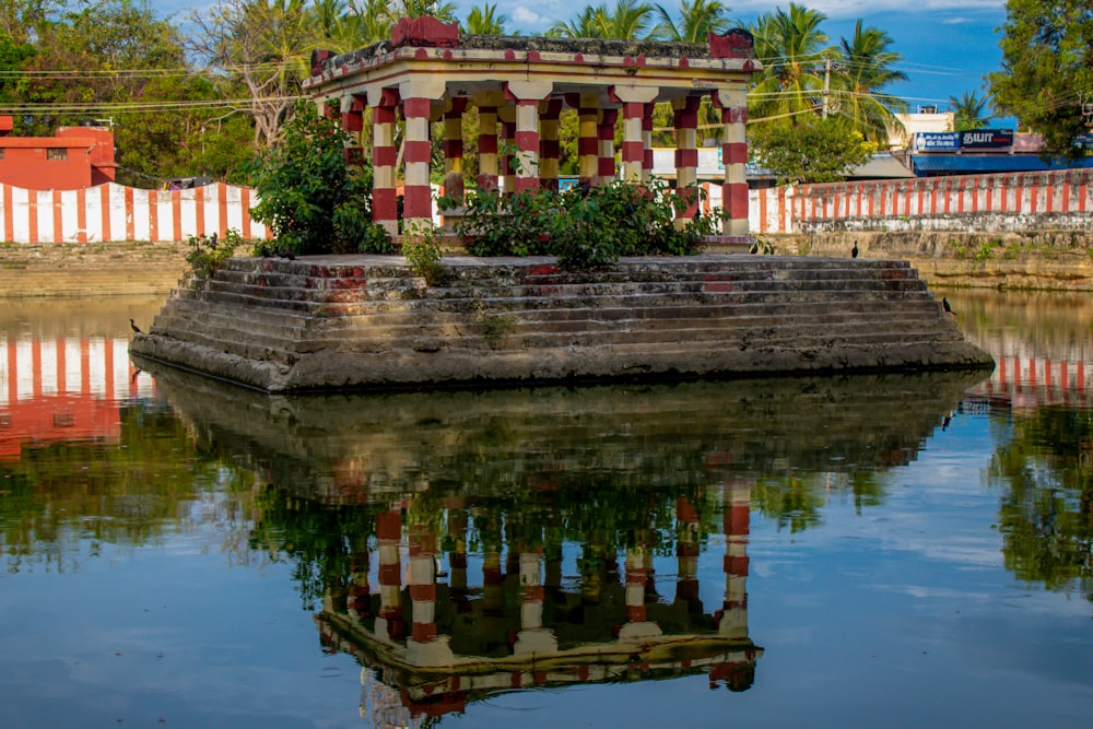 a building sitting on top of a body of water