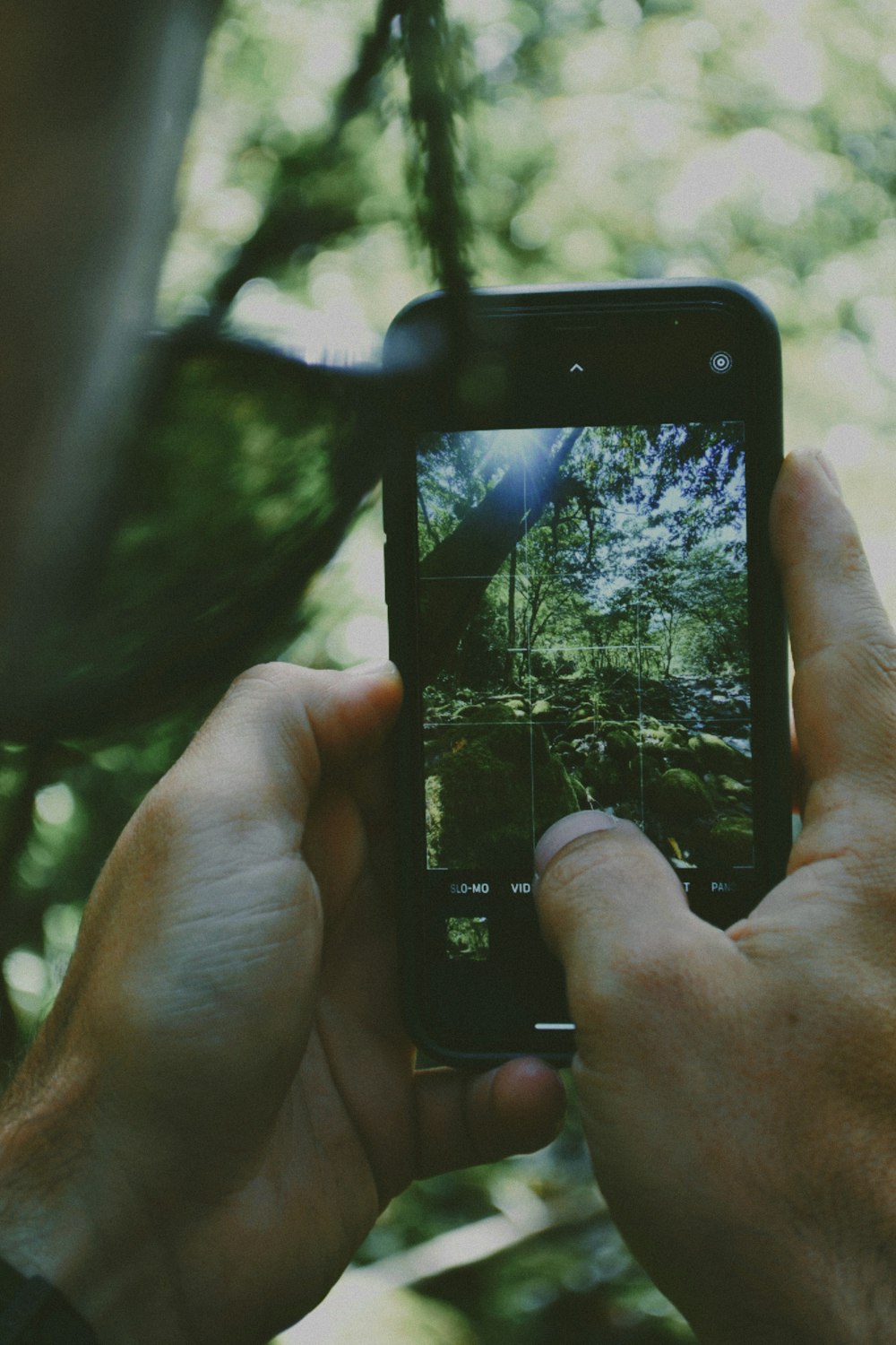 a person taking a picture with a cell phone