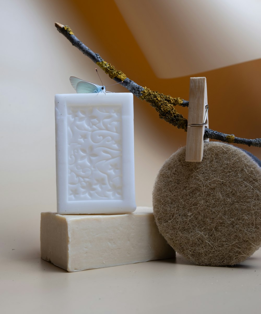 a soap bar sitting next to a stone