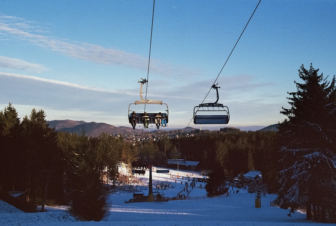 a ski lift with two people on it,