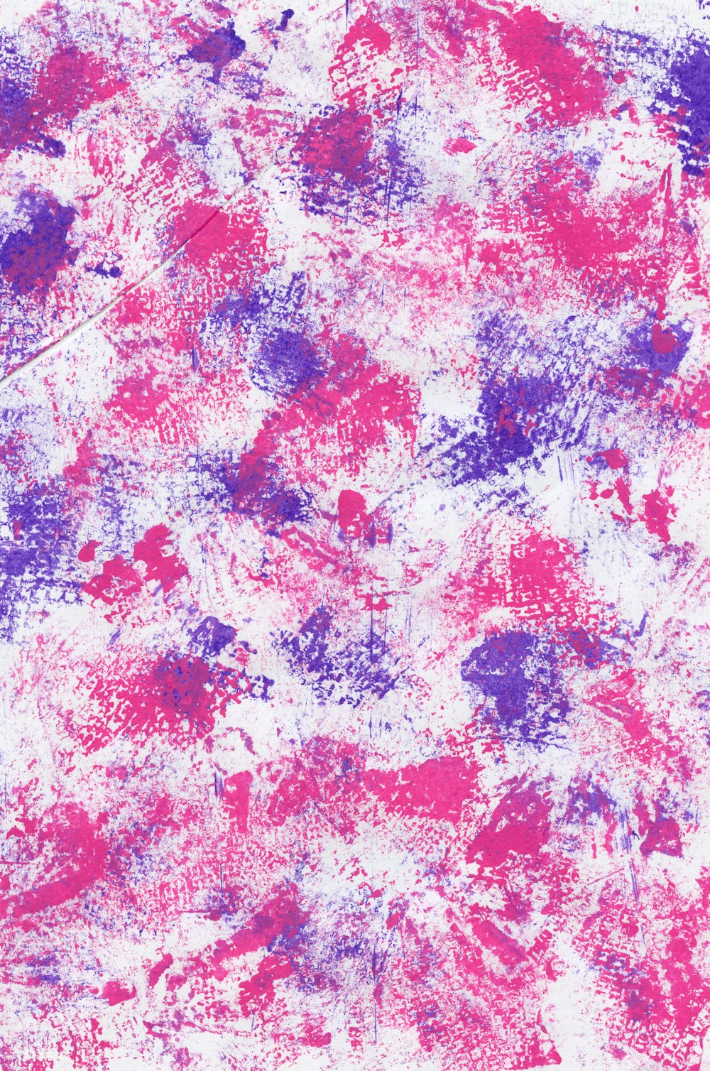 a pink and purple paint splattered on a white surface