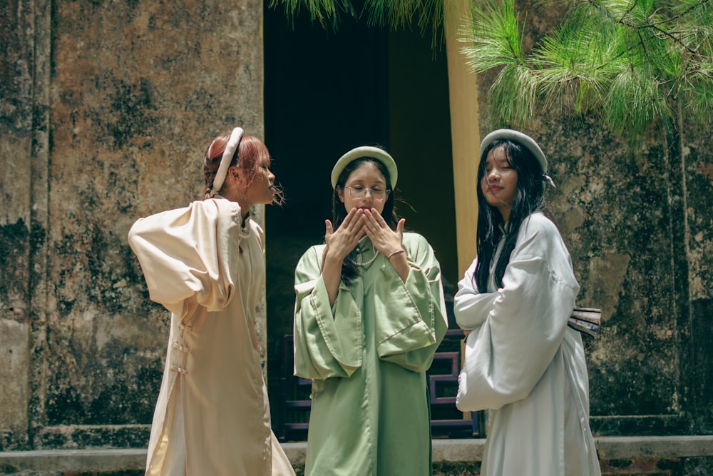 a group of women standing next to each other