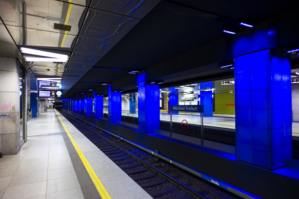 a train station with a train on the tracks