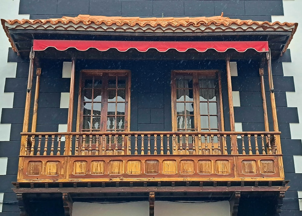 a building with a wooden balcony and balconies
