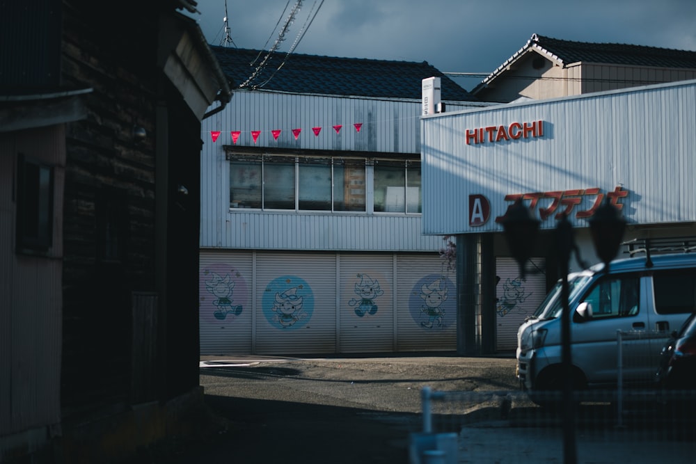 a white truck parked in front of a building