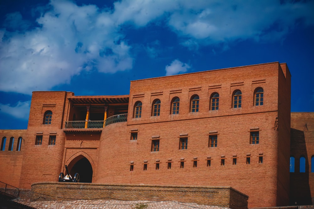 a large brick building with a clock tower