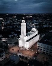 an aerial view of a large building with a clock tower