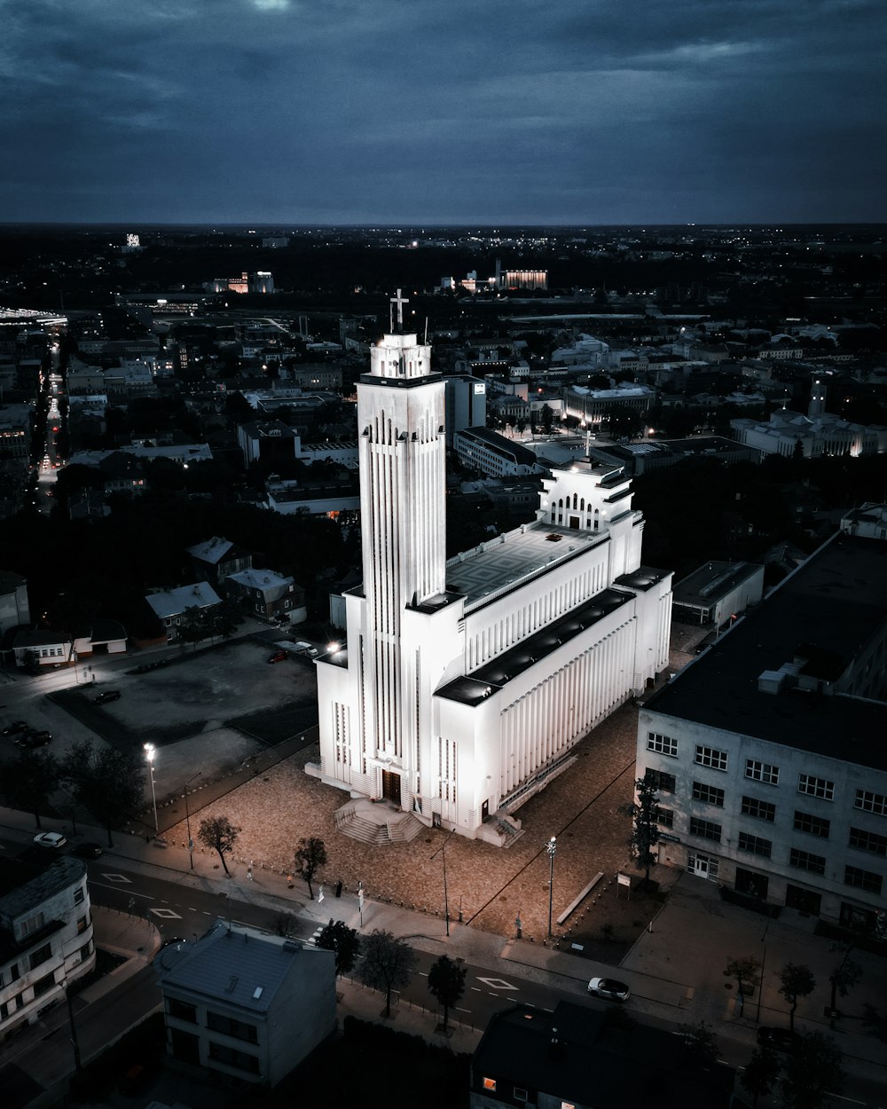 an aerial view of a large building with a clock tower