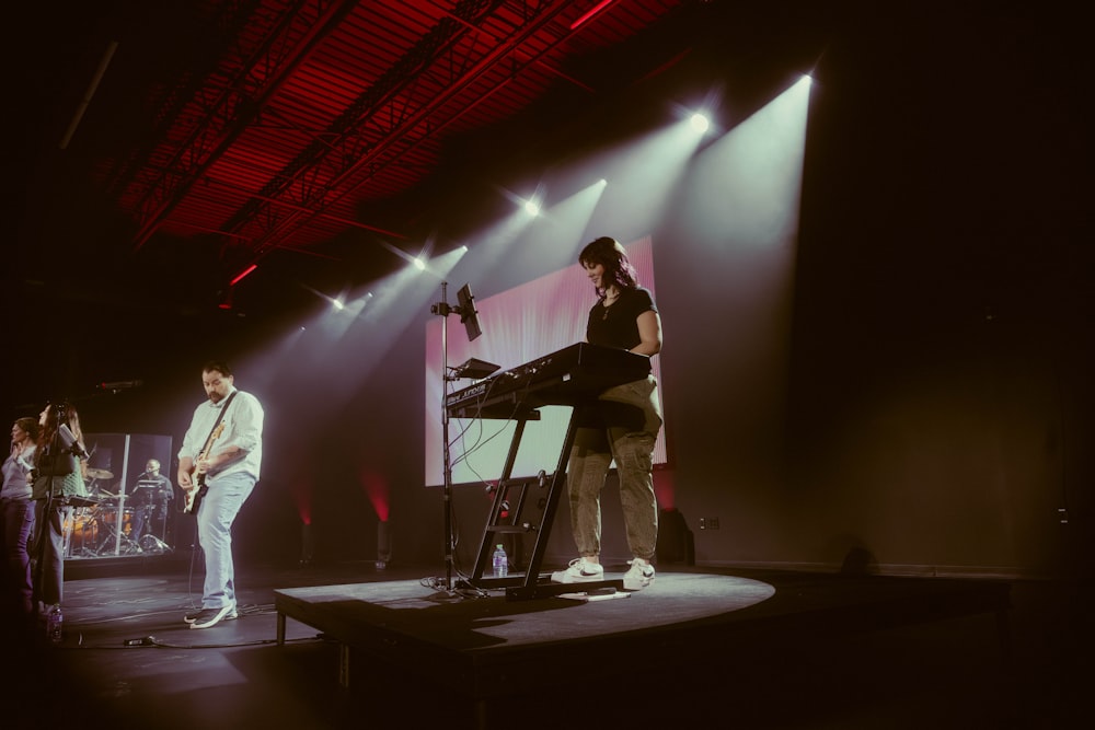 a group of people standing on top of a stage