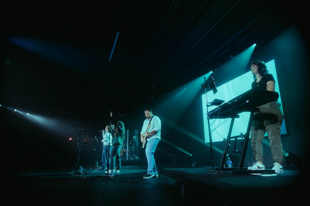 a group of people standing on top of a stage