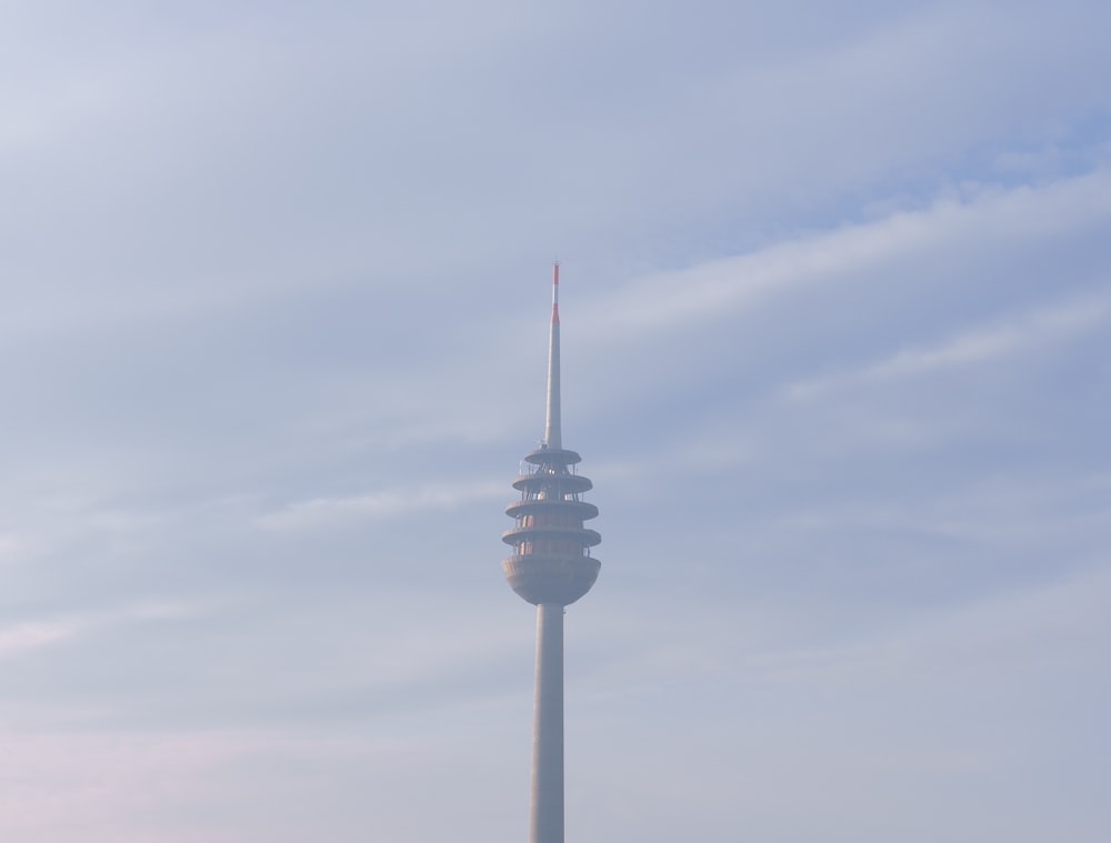 a tall tower with a sky background