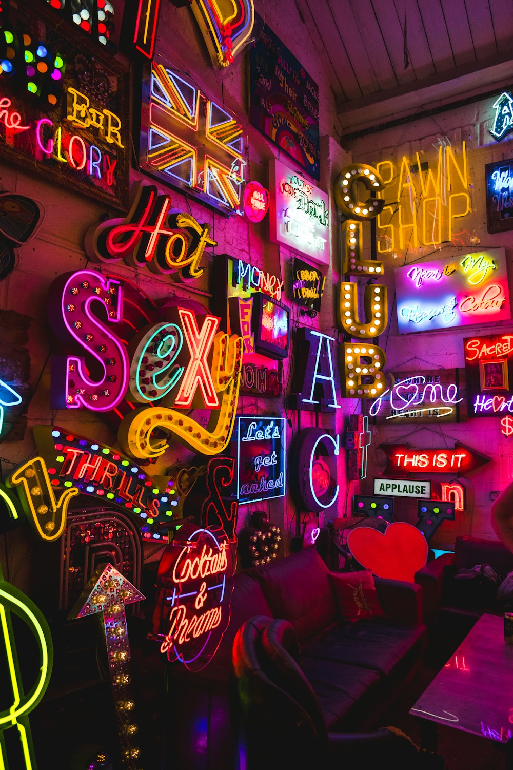a room filled with neon signs and neon lights