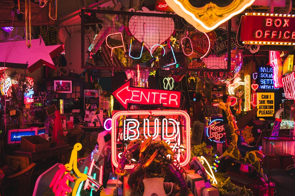 a room filled with lots of neon signs