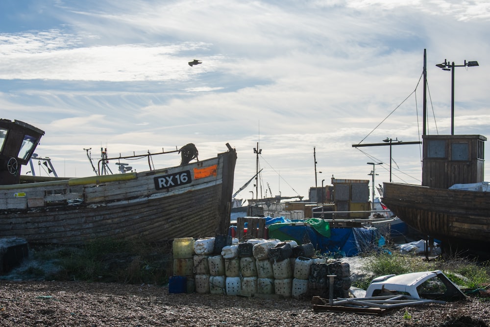 a couple of boats sitting on top of a beach