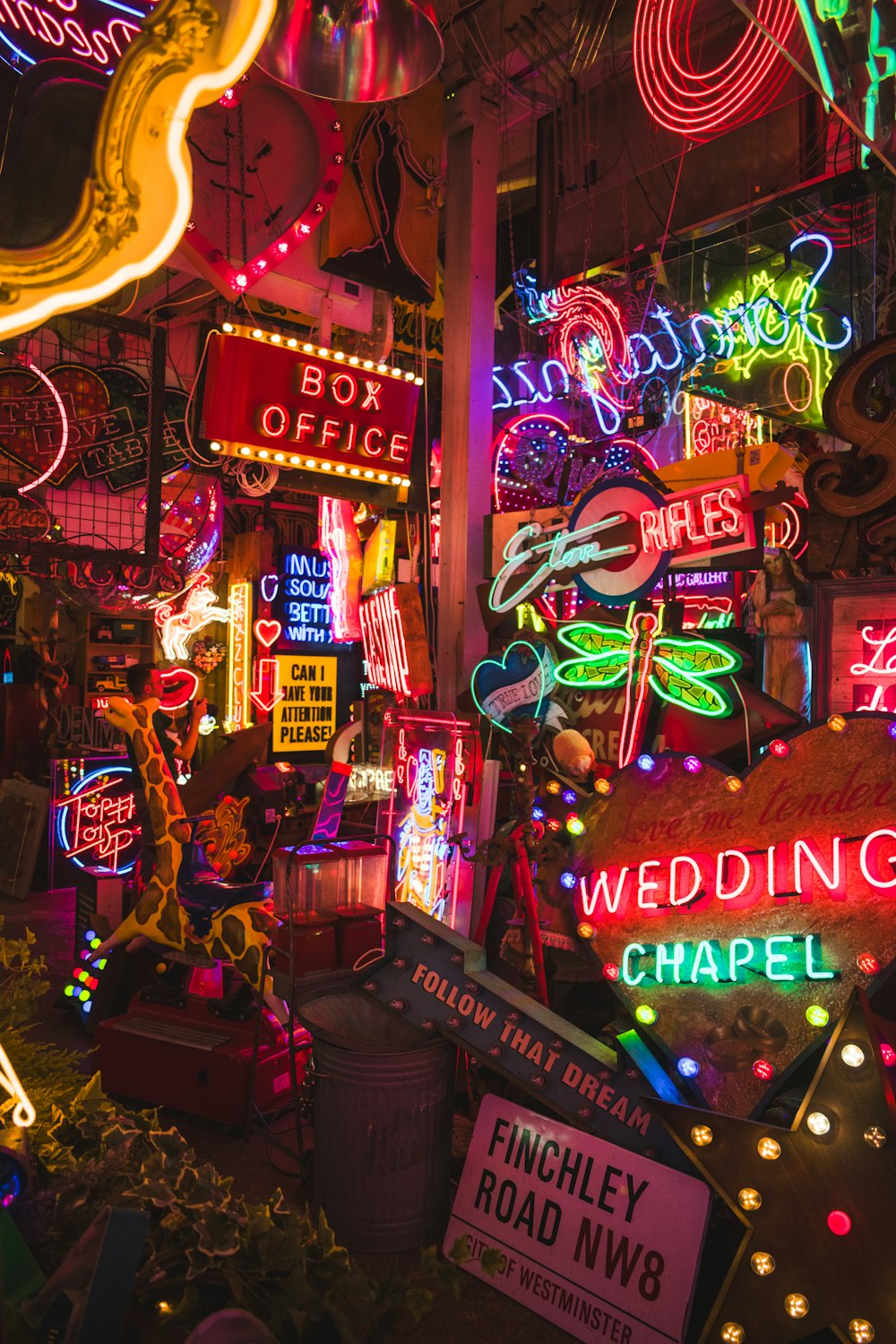 a room filled with neon signs and neon lights