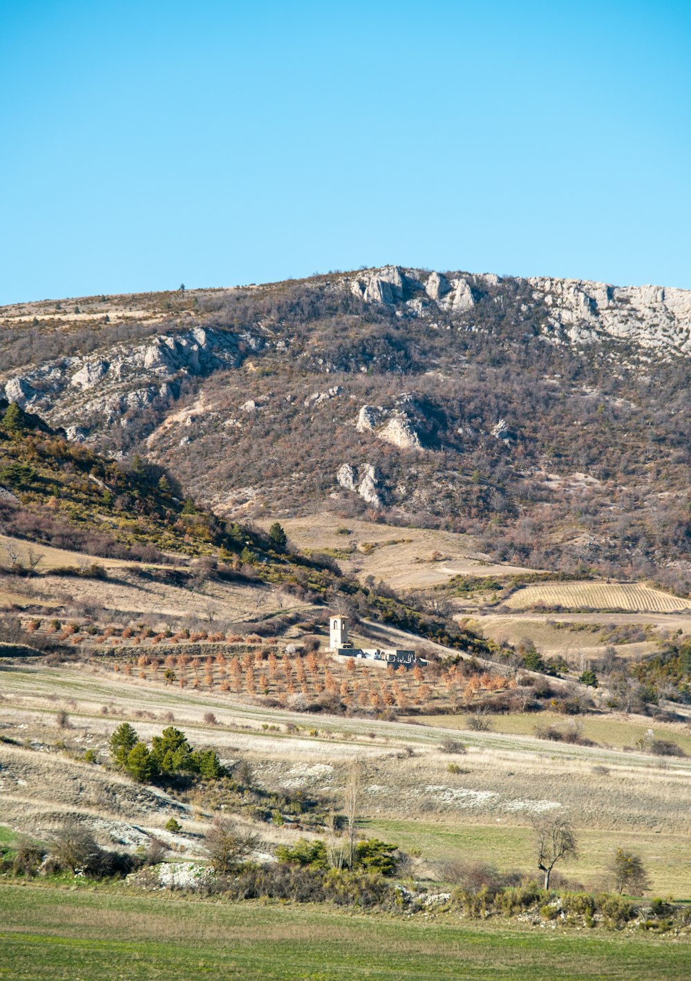 a mountain with a house in the middle of it