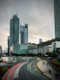a view of a city street with tall buildings