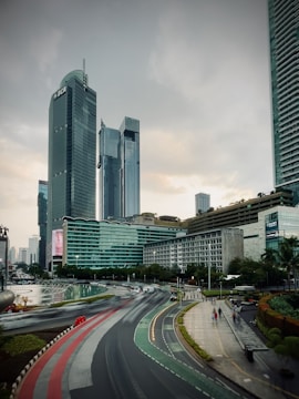 a view of a city street with tall buildings