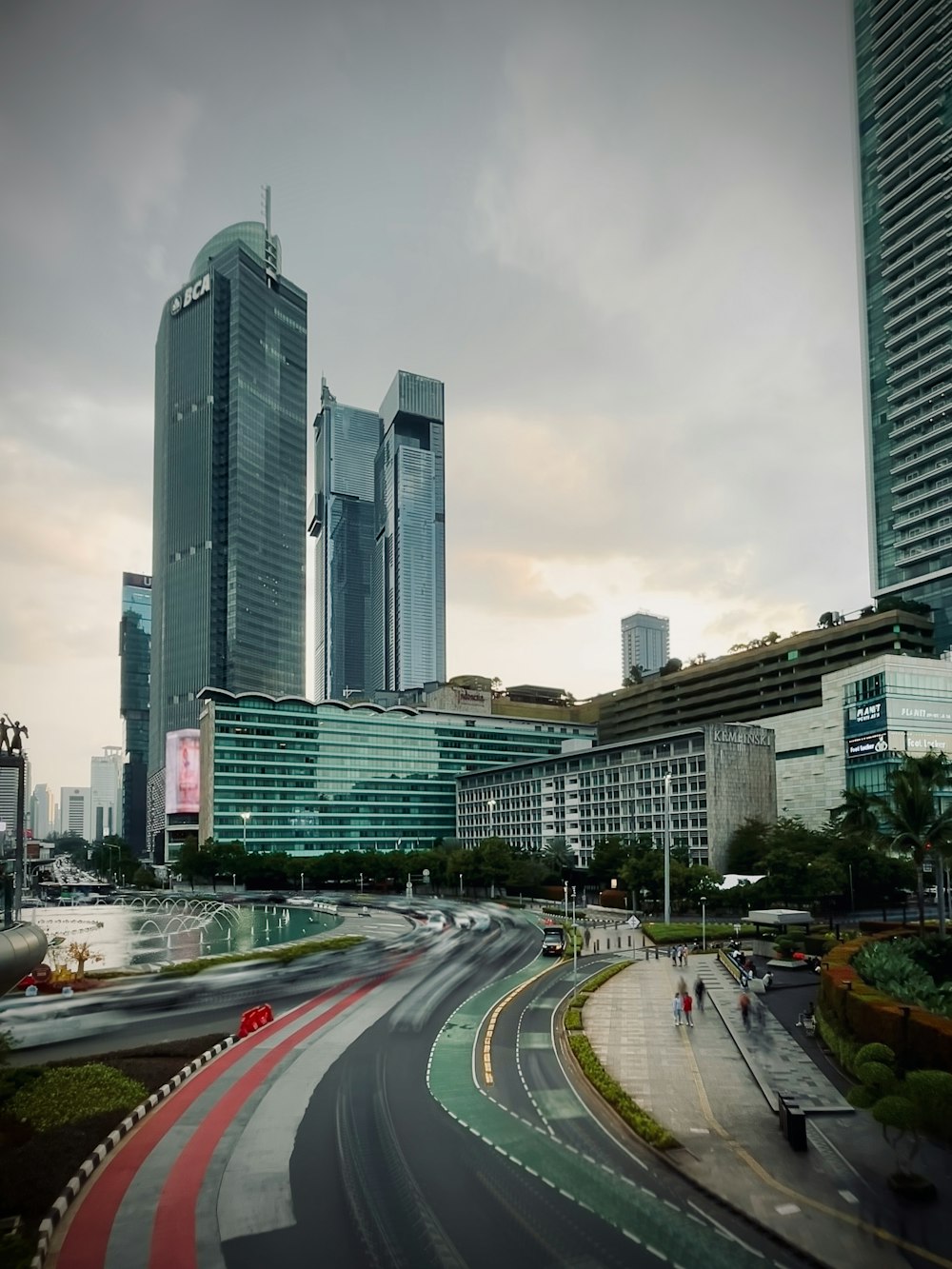 a view of a city street with tall buildings