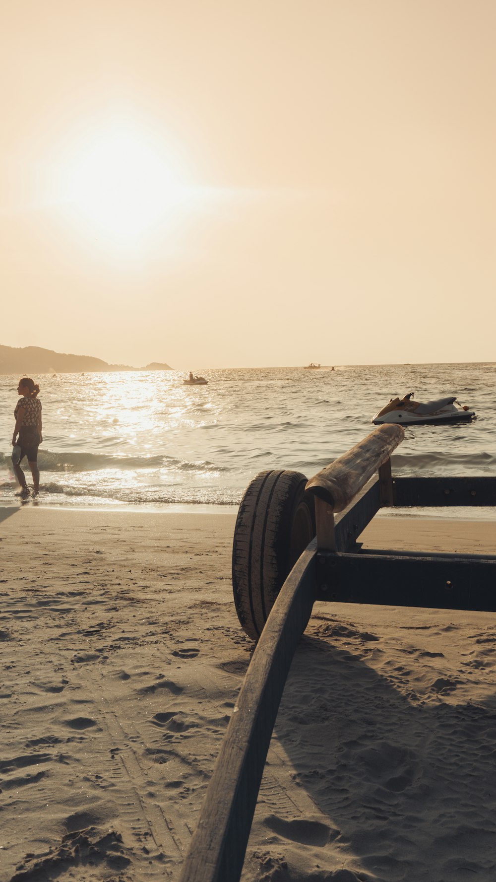 a person standing on a beach next to the ocean