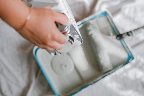 a person is holding a video game controller