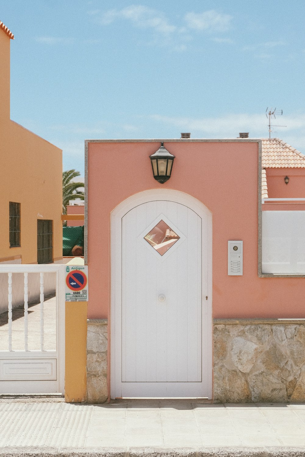 a pink house with a white front door