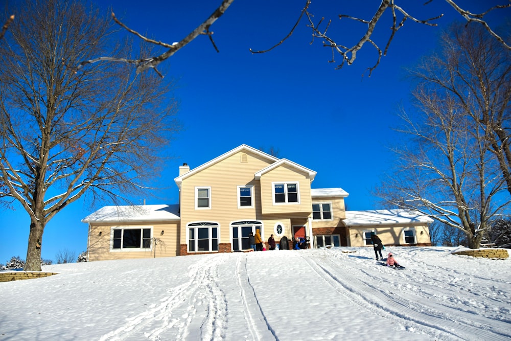 a large house with a lot of snow on the ground