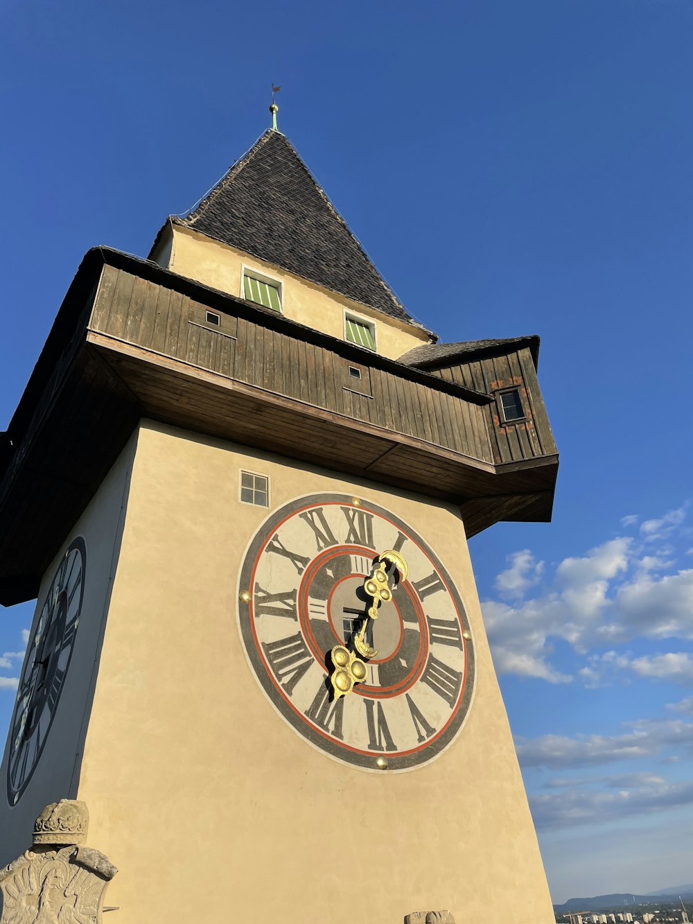 a large clock tower with a sky background