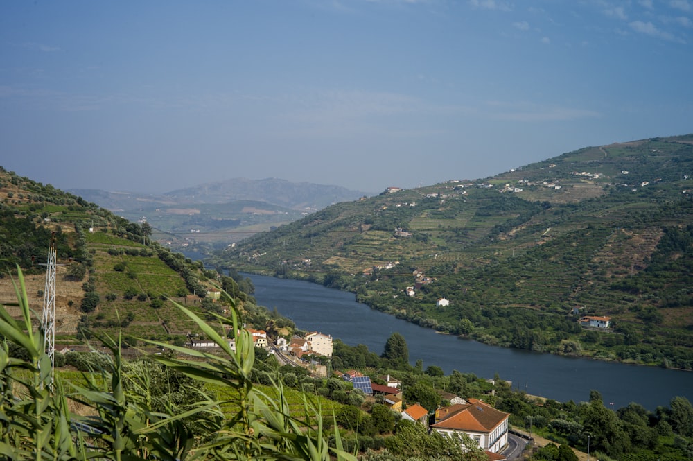 a river running through a lush green hillside