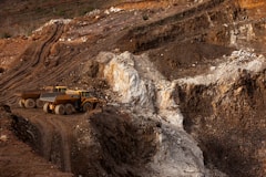 a large truck driving down a dirt road