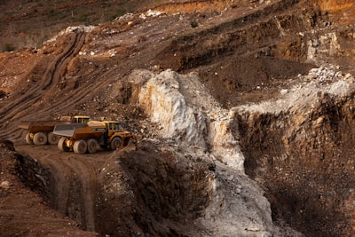 a large truck driving down a dirt road