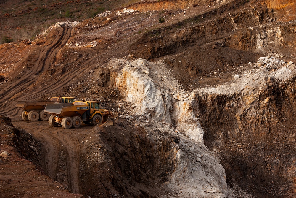 a large truck driving down a dirt road