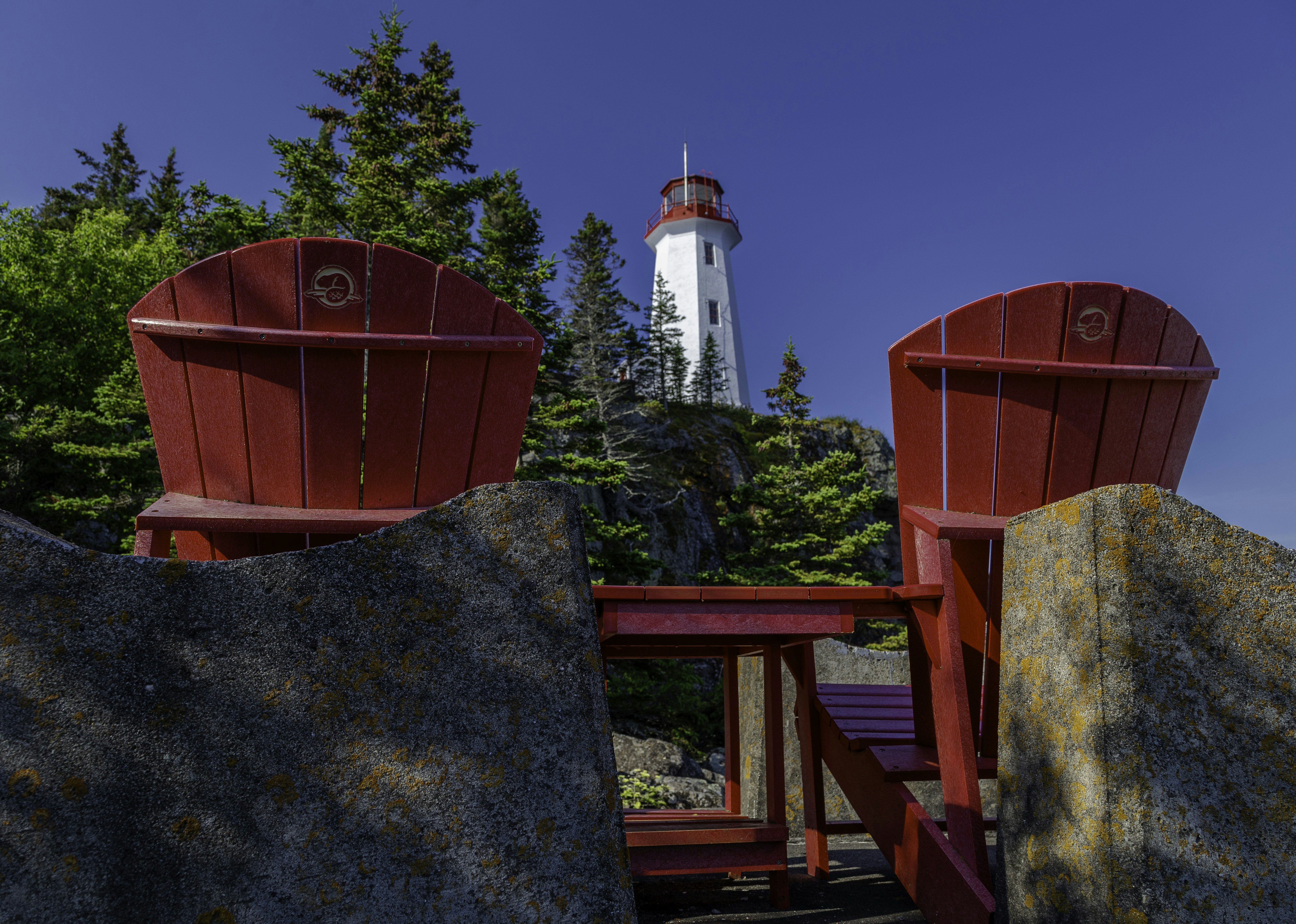 a couple of red chairs sitting next to each other