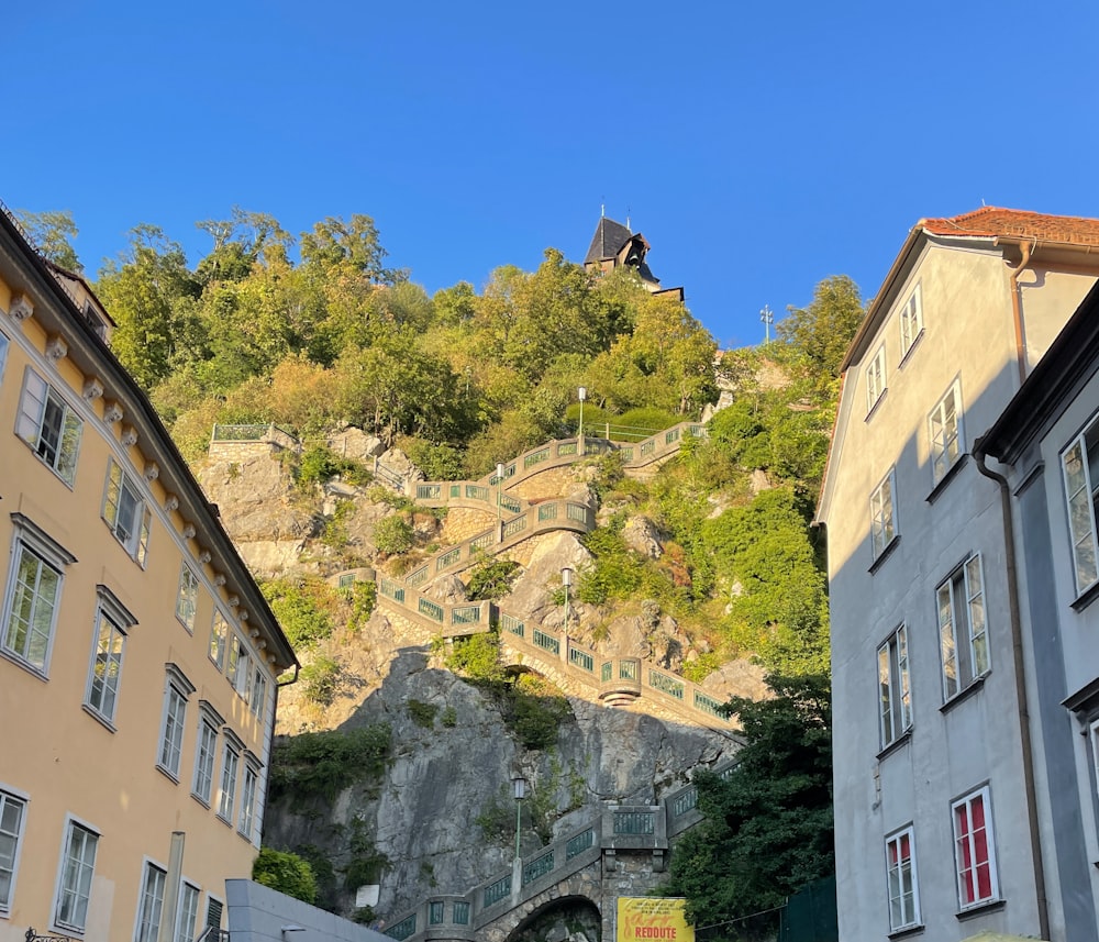 a city street with a hill in the background