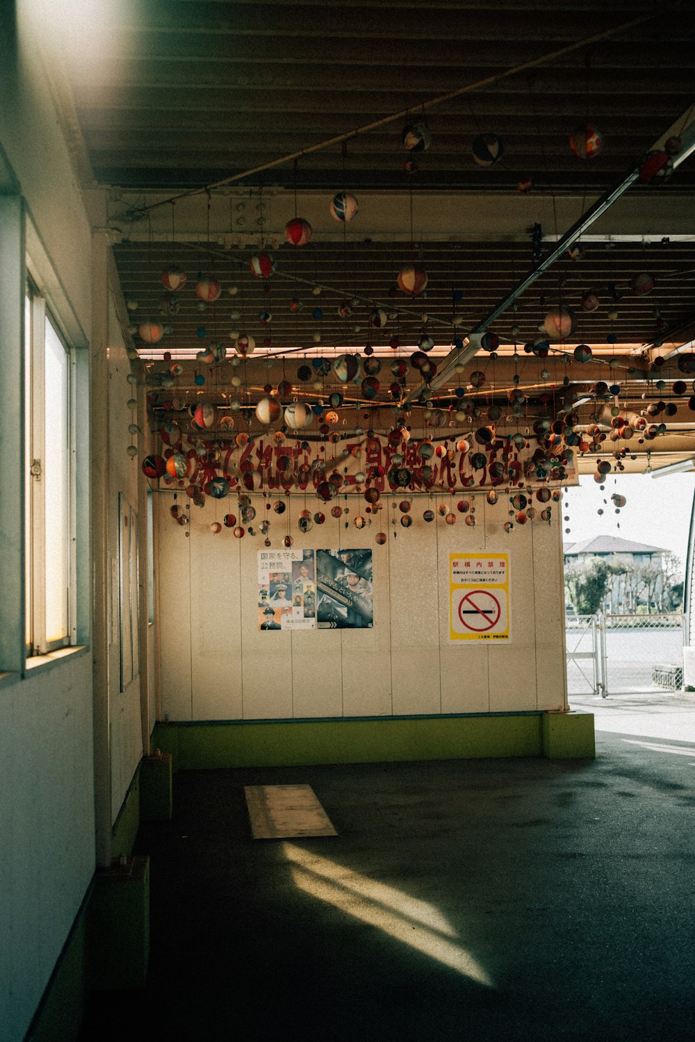 a room with a bunch of ornaments hanging from the ceiling