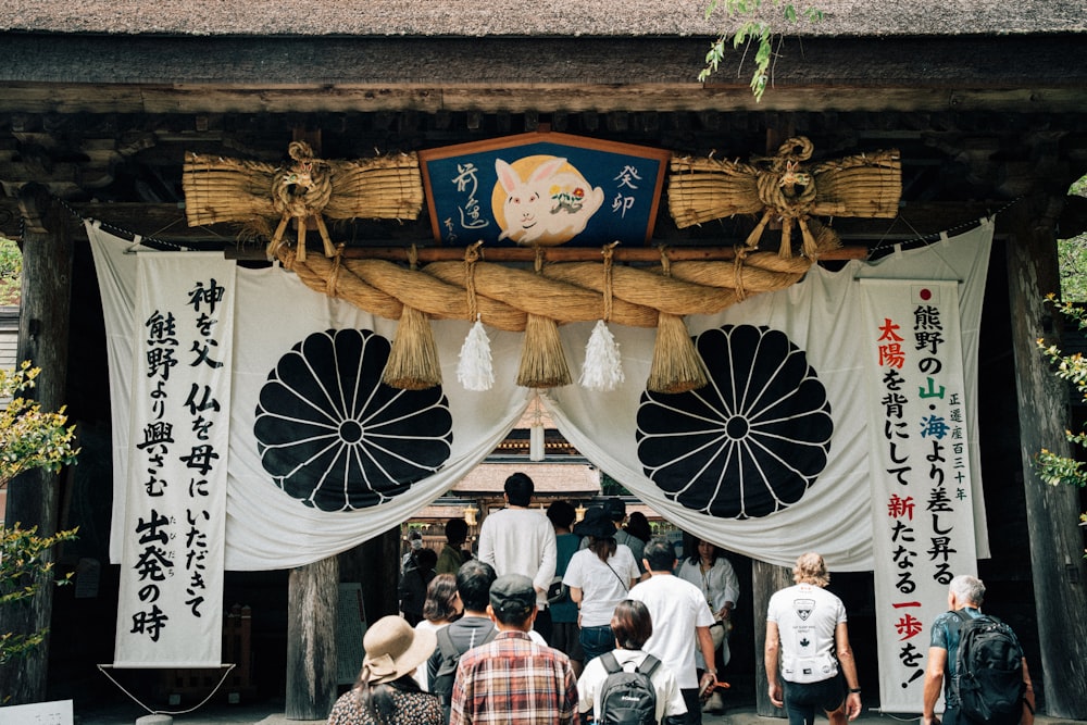 a group of people standing in front of a building