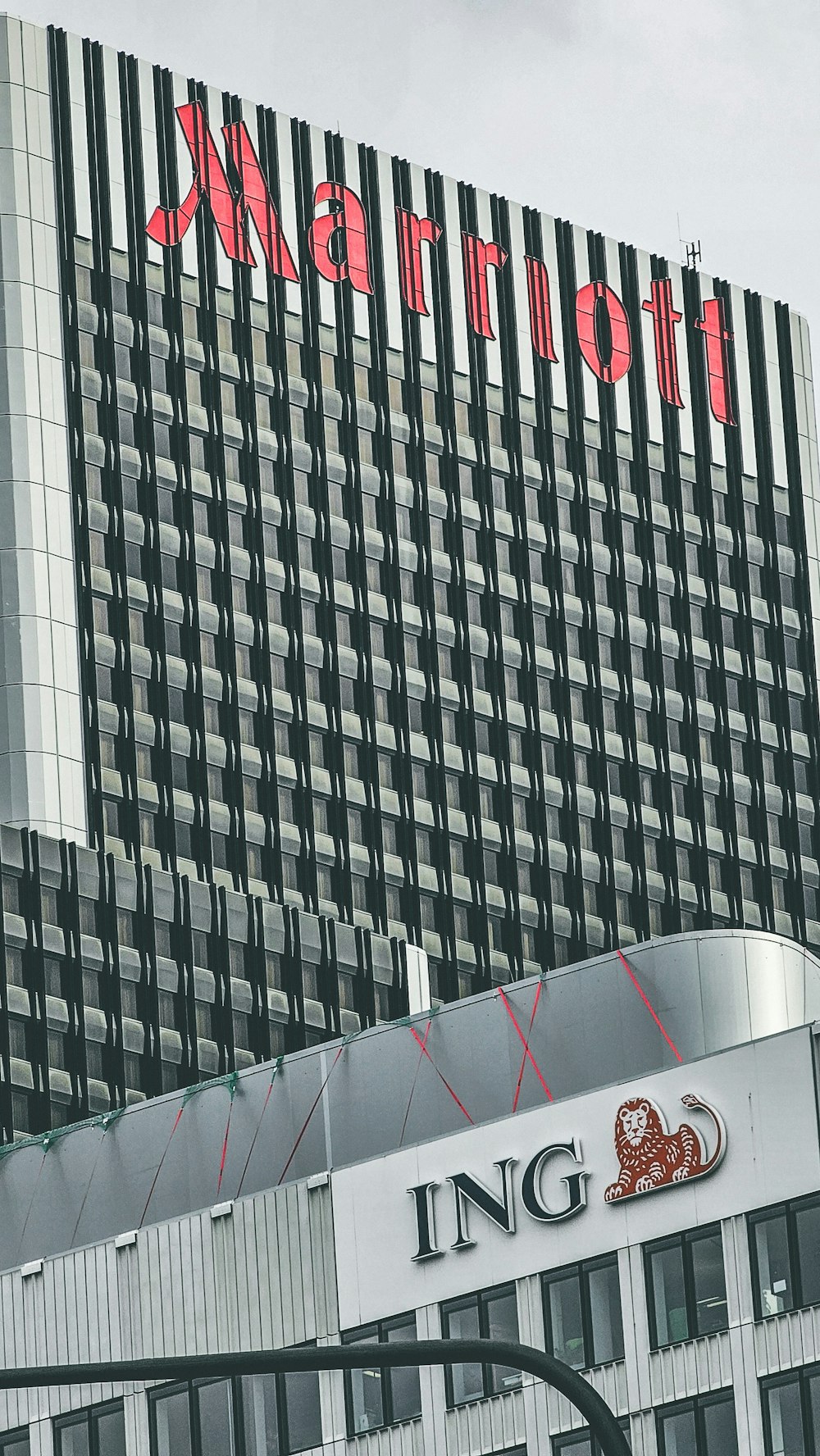 a very tall building with a big sign on it's side