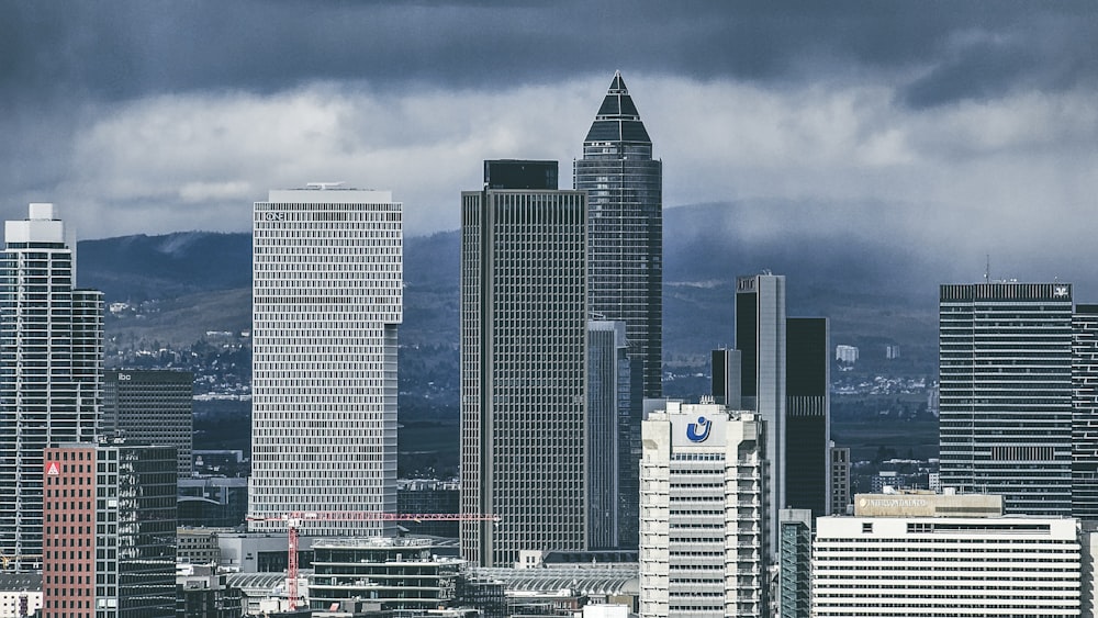 a city with tall buildings and a cloudy sky