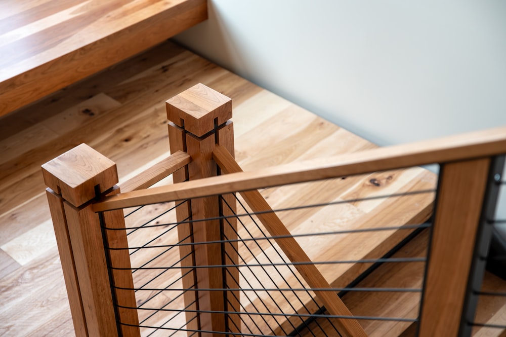 a close up of a metal and wood railing