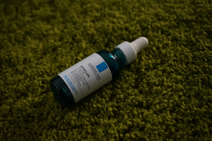 a bottle of eye gel sitting on top of a green carpet
