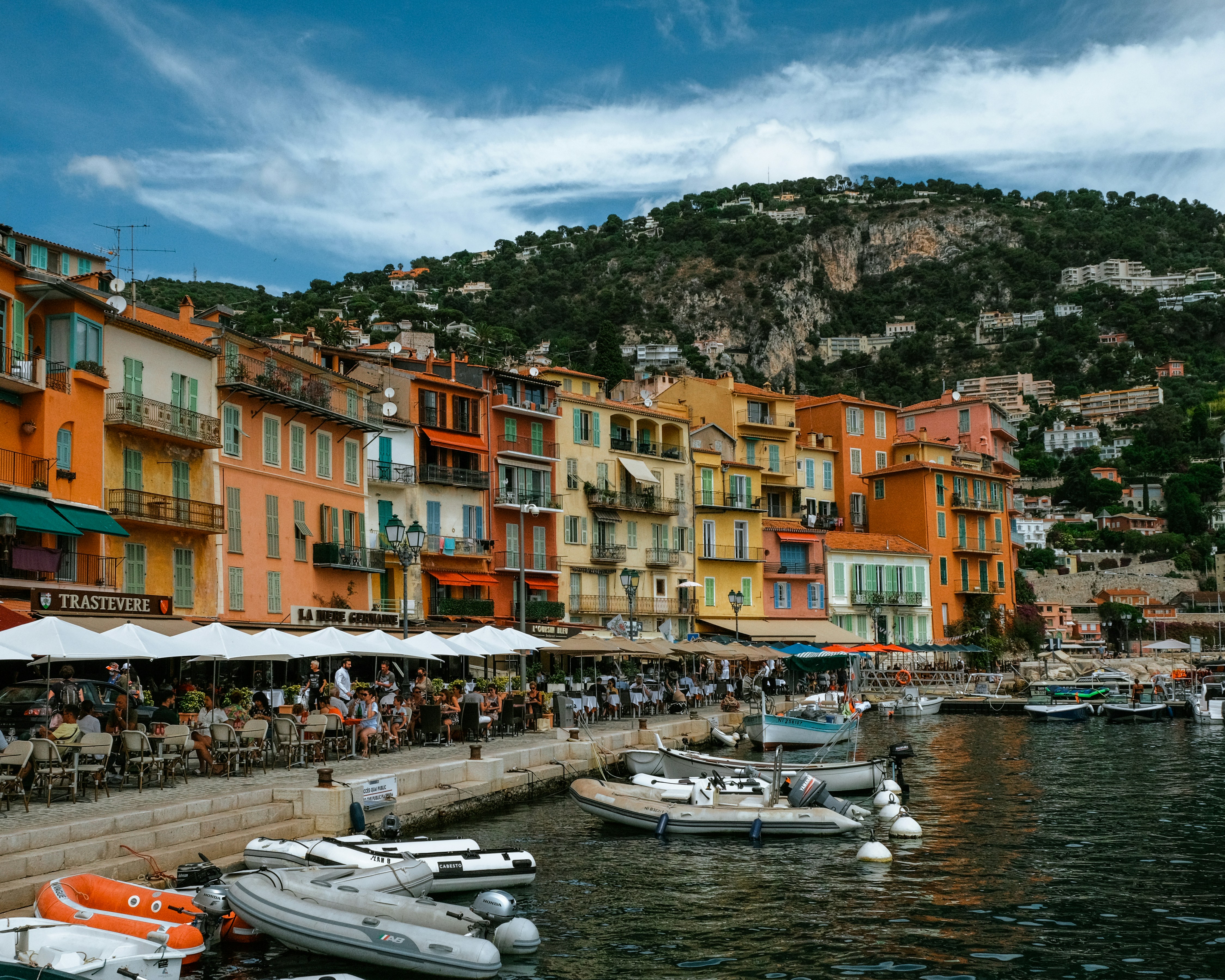 a group of boats floating on top of a body of water
