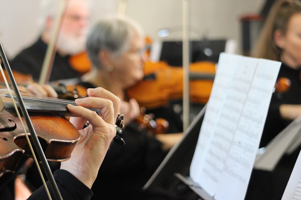 a group of people playing musical instruments in a room