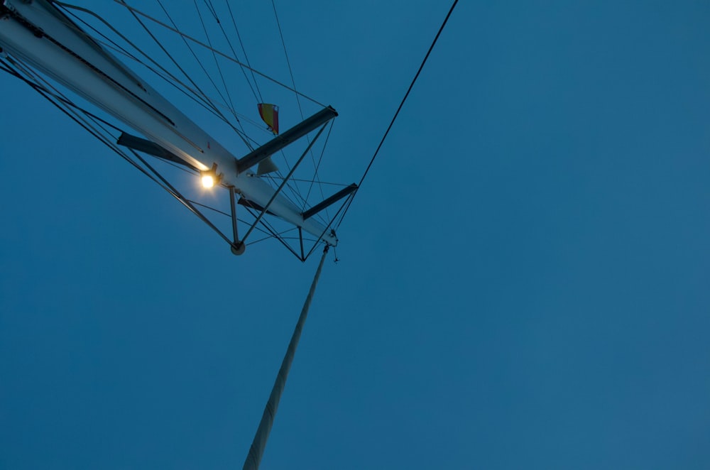 a white airplane flying through a blue sky