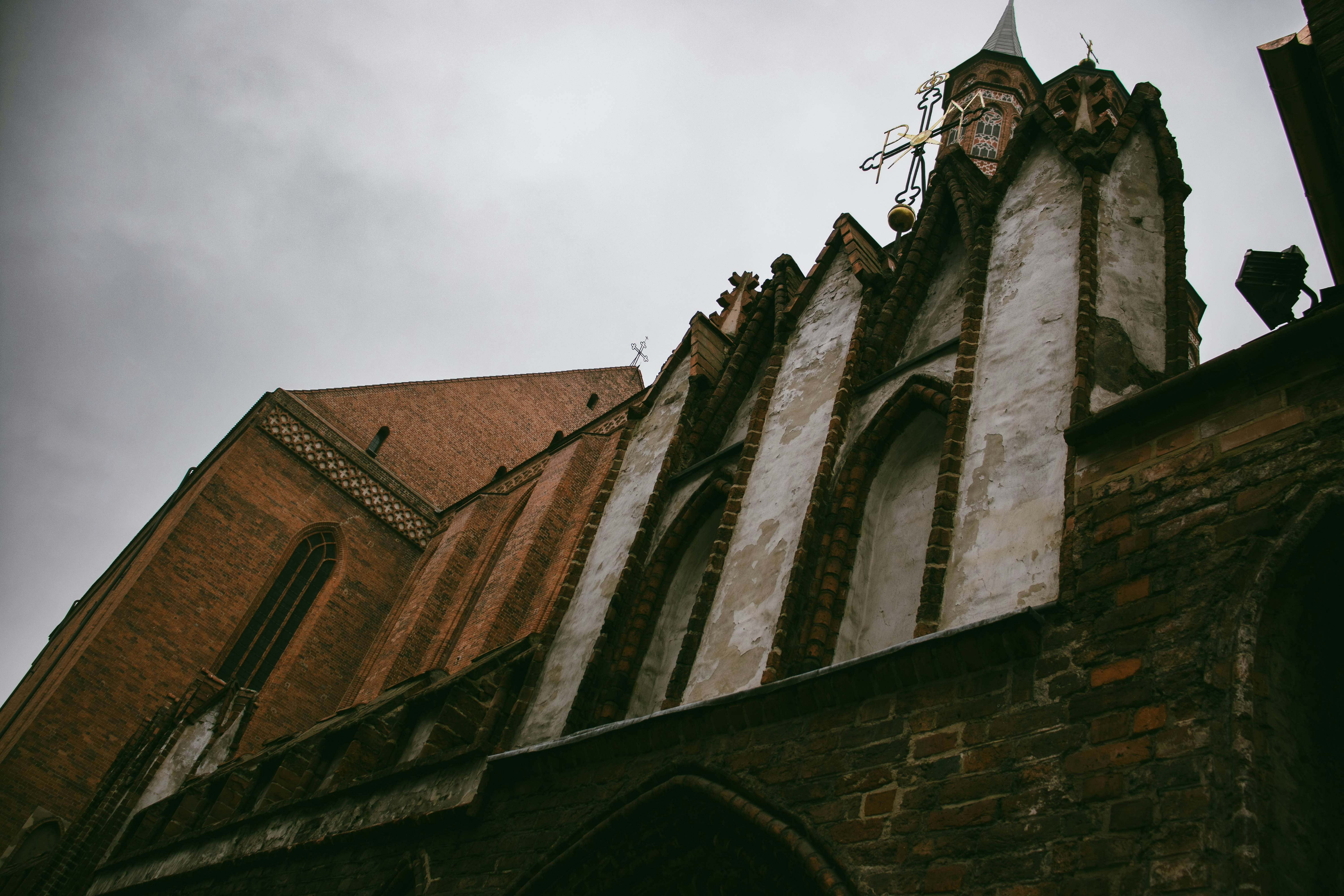 an old building with a clock on the side of it