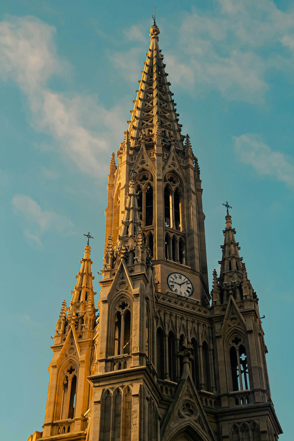 a very tall building with a clock on it's side